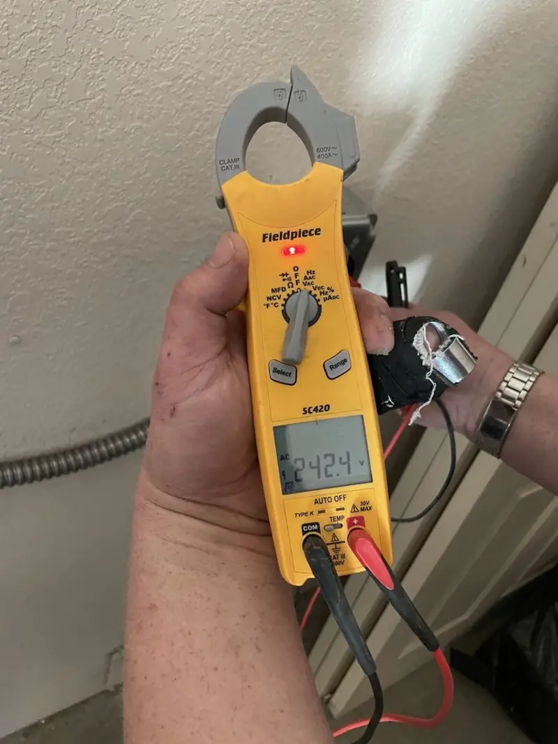 Voltage testing with clamp meter during Whole House Surge Protector in Annandale